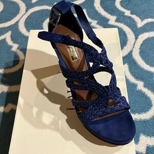 Barely worn, micro suede with woven pattern across top of sandal. 4.5 inch heel